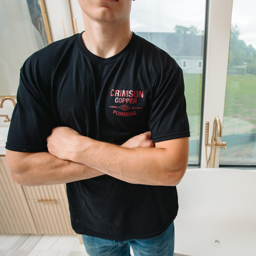plumber standing in front of a bathtub