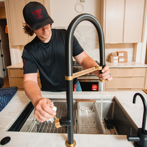 plumber installing a new faucet