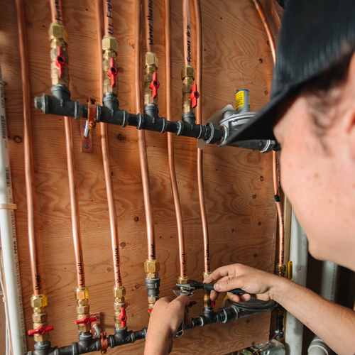 plumber installing gas lines
