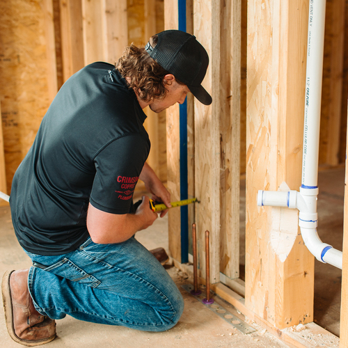 plumber installing new pipes